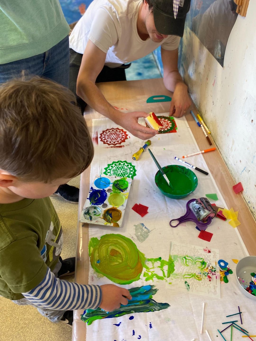 Children do painting crafts at Discovery Nursery
