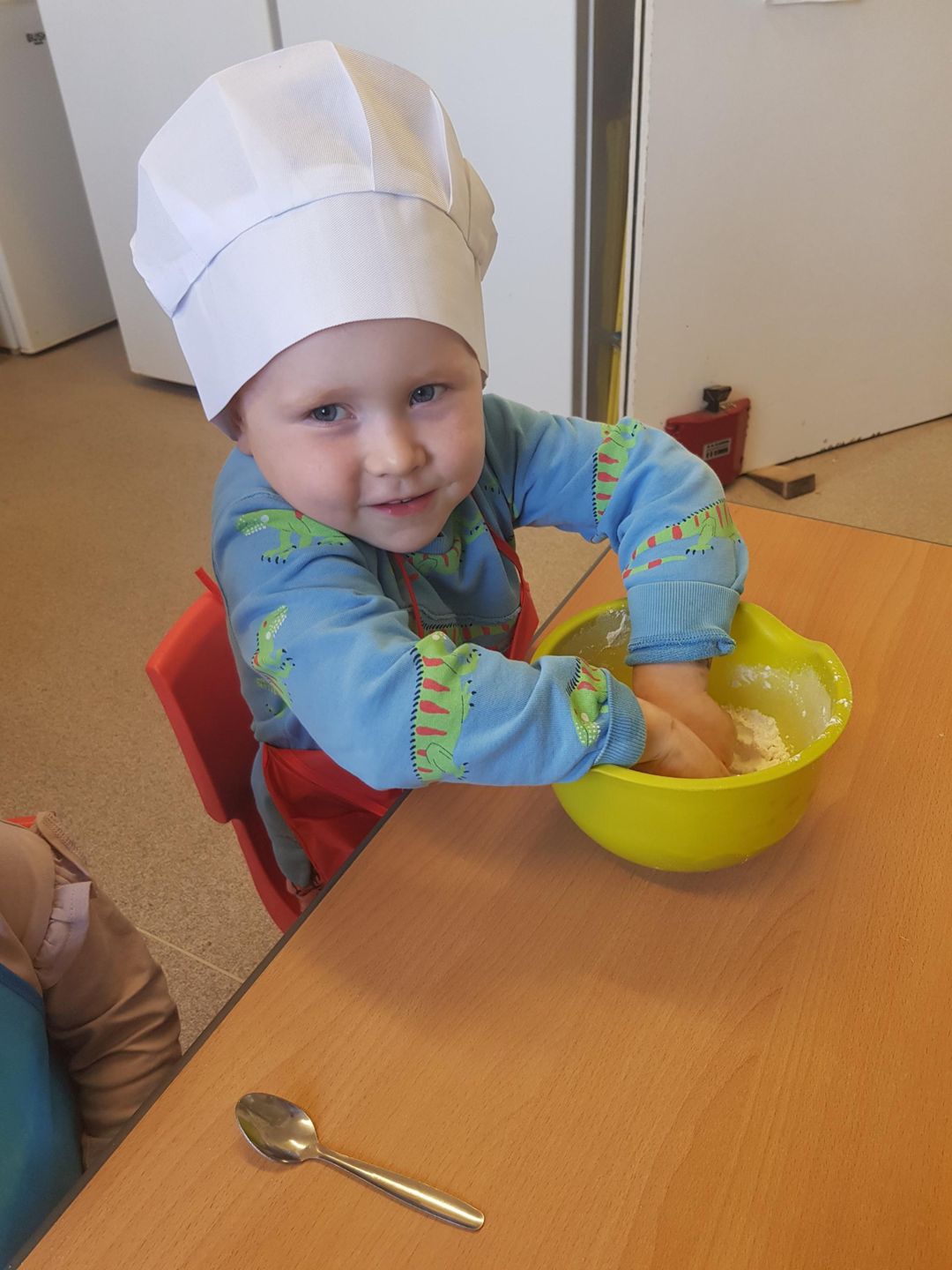 nursery child in a cooking class