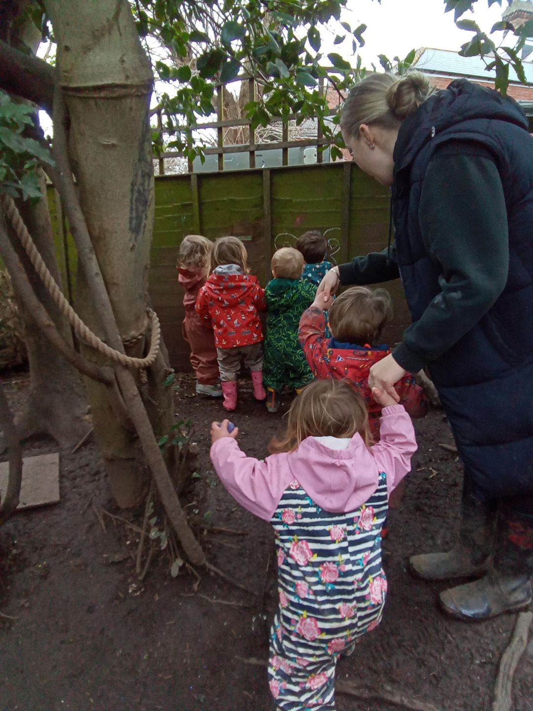 Nursery children playing in the mud