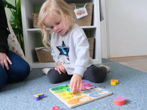 A toddler at Devon Nurseries playing during summer